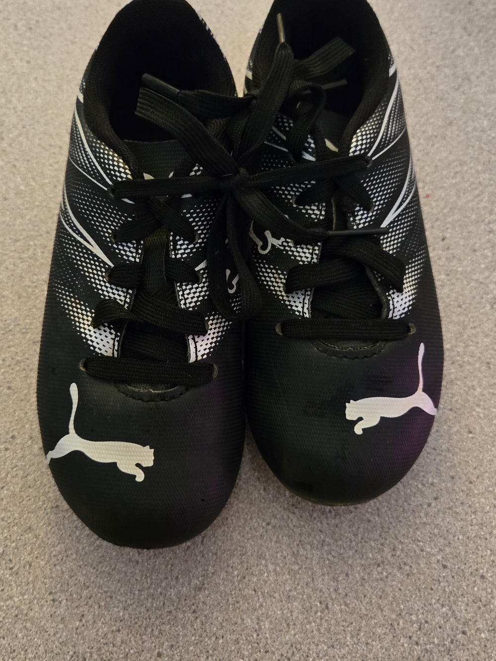 Size 10 Puma Kids Black Cleats with White Puma Logos and White Accents